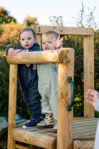 Two toddlers on the climbing frame